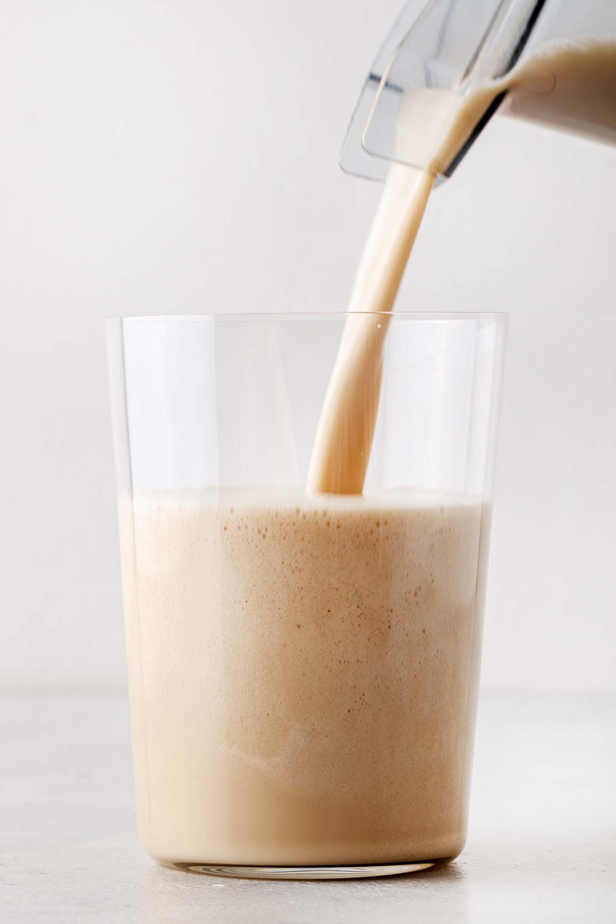 Vanilla protein shake in a glass.