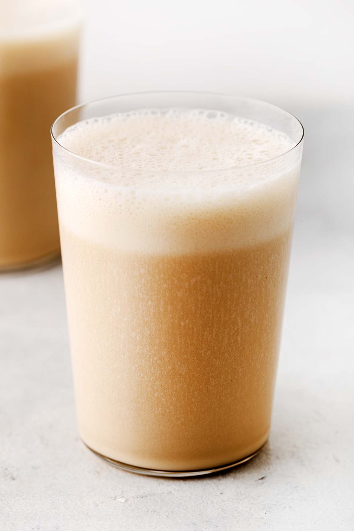 Vanilla protein shake in a glass.